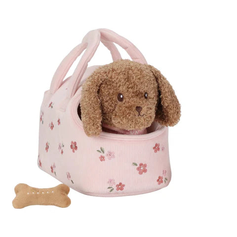 Chien en peluche avec son sac de transport